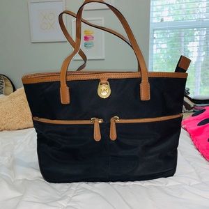 Black/brown leather 
Gold detailing 
In good shape